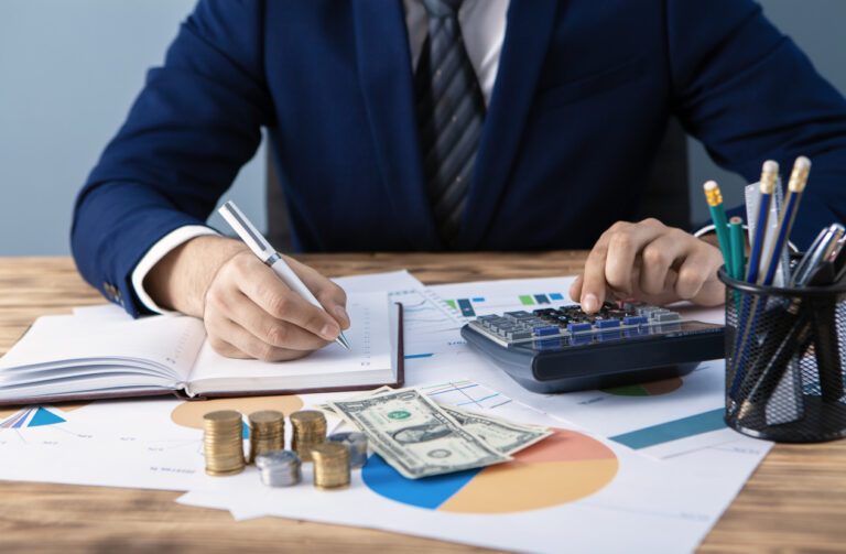 businessman in office with documents and money on the table, analysis, business concept